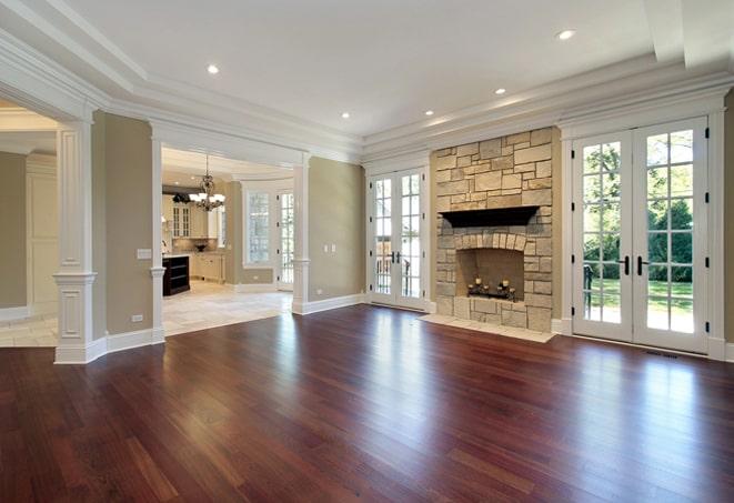 home gym featuring durable wood floors